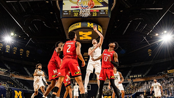 Isaiah Livers (2), Franz Wagner (21), Hunter Dickinson (1), Eli Brooks (55), and Mike Smith (12)