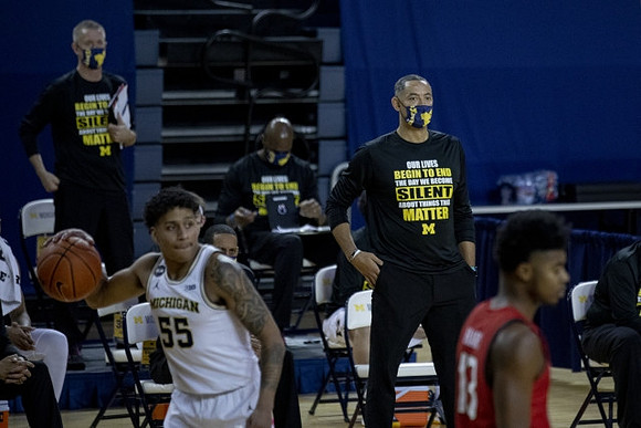 Eli Brooks (55) and Juwan Howard