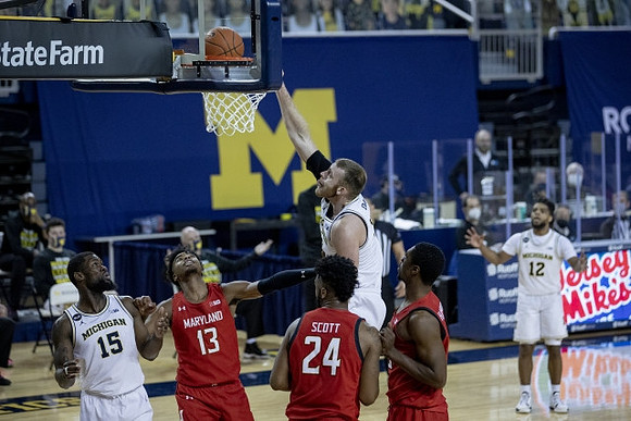 Chaundee Brown Jr. (15), Austin Davis (51), and Mike Smith (12)