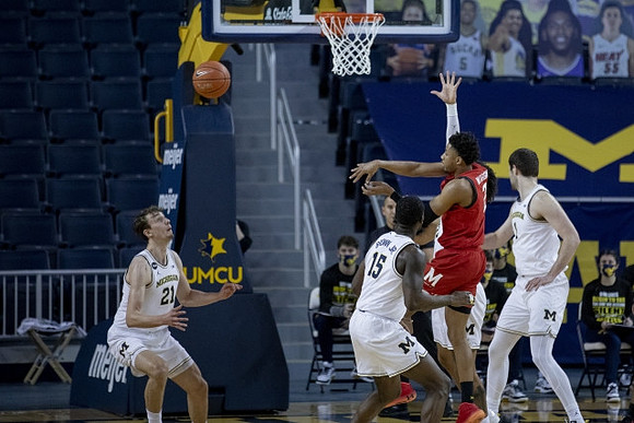 Franz Wagner (21), Chaundee Brown Jr. (15), and Hunter Dickinson (1)