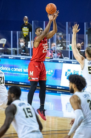 Franz Wagner (21), Chaundee Brown Jr. (15), Isaiah Livers (2), and Austin Davis (51)