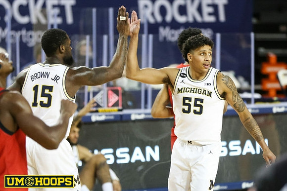 Chaundee Brown Jr. (15) and Eli Brooks (55)