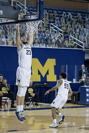 Brandon Johns Jr. (23) and Eli Brooks (55)
