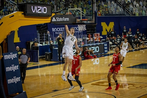 Franz Wagner (21), Eli Brooks (55), and Juwan Howard