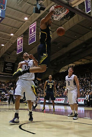 Jordan Morgan (52) and Trey Burke (3)