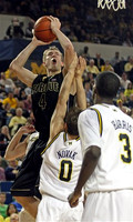 Zack Novak (0) and Manny Harris (3)