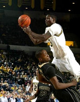 Manny Harris (3) and Jevohn Shepherd (22)