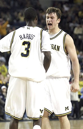 Zack Novak (0) and Manny Harris (3)