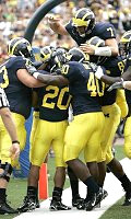Michael Hart, Chad Henne, Alex Mitchell, Obi Oluigbo, and Carson Butler