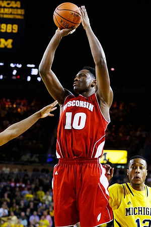Max Bielfeldt (44), Derrick Walton Jr. (10), and Ricky Doyle (32)