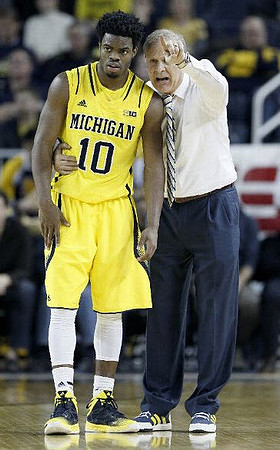 Derrick Walton Jr. (10) and John Beilein