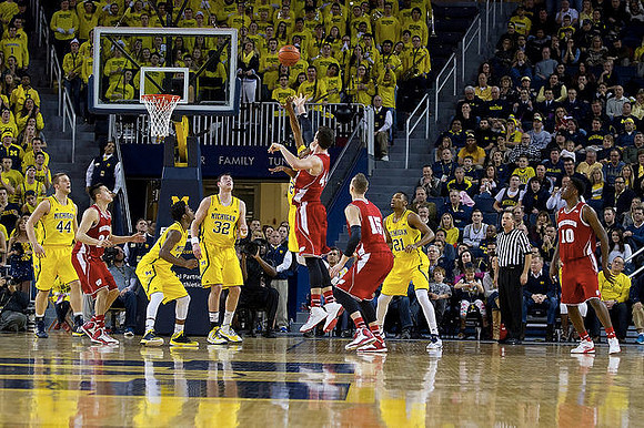 Zak Irvin (21), Muhammad-Ali Abdur-Rahkman (12), Derrick Walton Jr. (10), and Ricky Doyle (32)