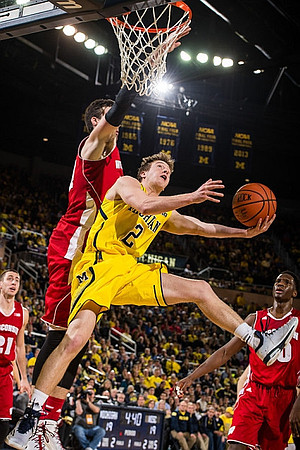 Spike Albrecht (2) and Derrick Walton Jr. (10)