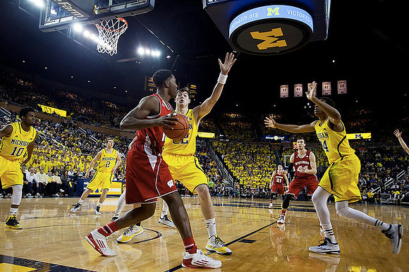 Aubrey Dawkins (24), Muhammad-Ali Abdur-Rahkman (12), and Derrick Walton Jr. (10)