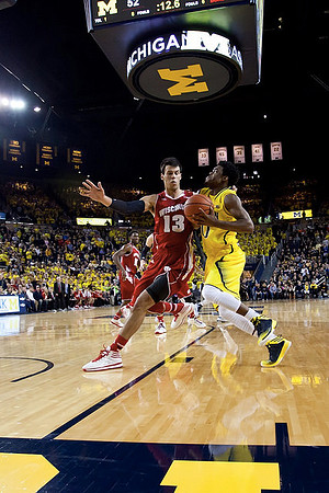Sean Lonergan (20), Mark Donnal (34), Derrick Walton Jr. (10), and Spike Albrecht (2)
