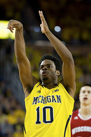 Derrick Walton Jr. (10) and Ricky Doyle (32)