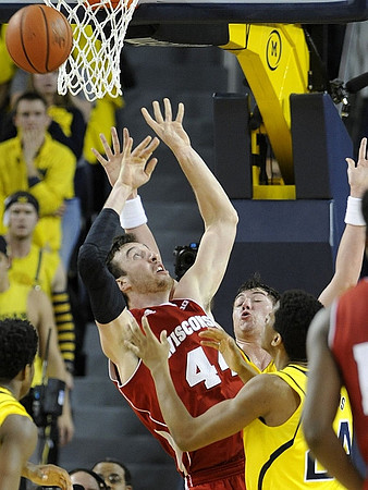 Derrick Walton Jr. (10), Ricky Doyle (32), and Aubrey Dawkins (24)
