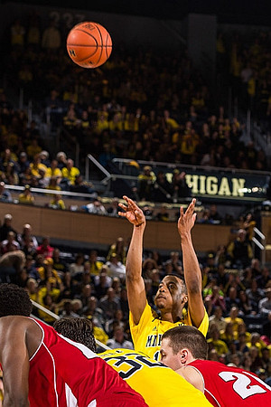 Kameron Chatman (3), Derrick Walton Jr. (10), and Ricky Doyle (32)