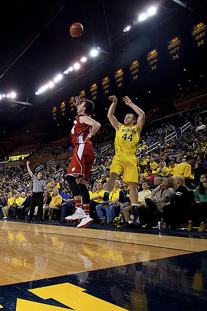 Kameron Chatman (3), Zak Irvin (21), and Mark Donnal (34)