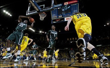 Zack Novak (0) and Evan Smotrycz (23)
