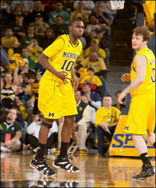 Tim Hardaway Jr. (10) and Zack Novak (0)