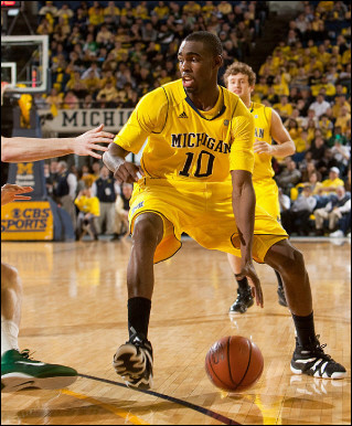 Tim Hardaway Jr. (10) and Zack Novak (0)