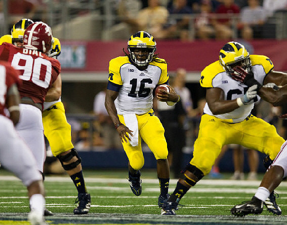Taylor Lewan (77), Denard Robinson (16), and Patrick Omameh (65)