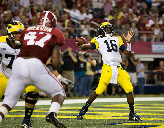 Michael Schofield (75) and Denard Robinson (16)