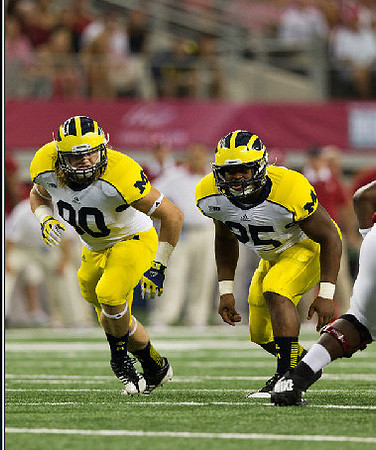 Jake Ryan (90) and Kenny Demens (25)
