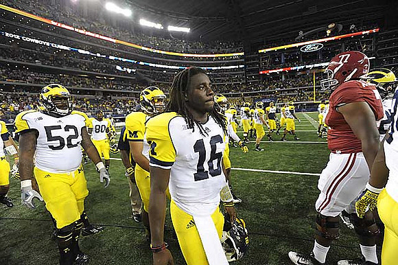 Ricky Barnum (52), Ricardo Miller (80), and Denard Robinson (16)