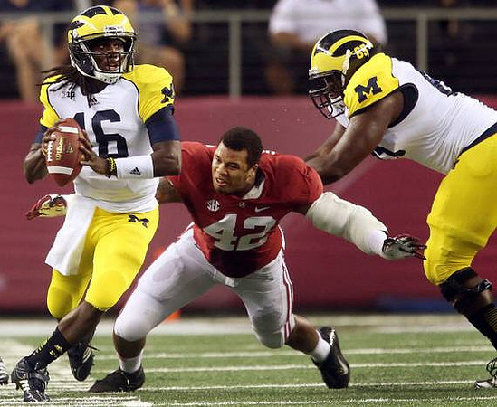 Denard Robinson (16) and Patrick Omameh (65)