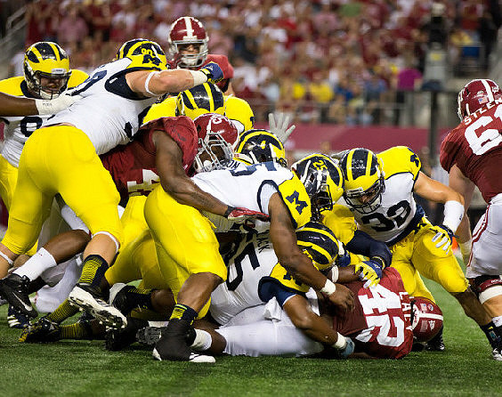 Jake Ryan (90), Cameron Gordon (4), Kenny Demens (25), and Jordan Kovacs (32)