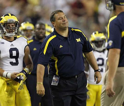 Drew Dileo (9) and Brady Hoke
