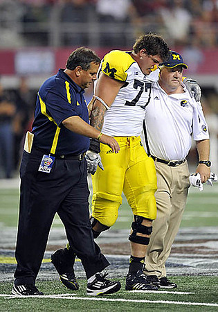 Brady Hoke and Taylor Lewan (77)