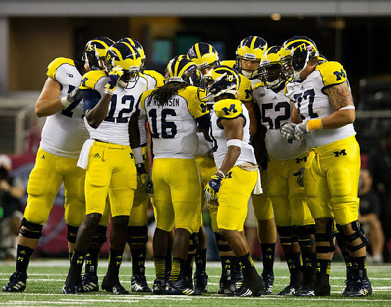 Michael Schofield (75), Devin Gardner (12), Denard Robinson (16), Jeremy Gallon (10), Ricky Barnum (52), and Taylor Lewan (77)