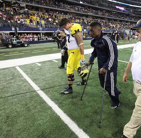 Taylor Lewan (77) and Blake Countess (18)