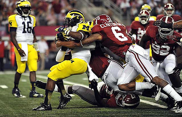 Denard Robinson (16) and Vincent Smith (2)