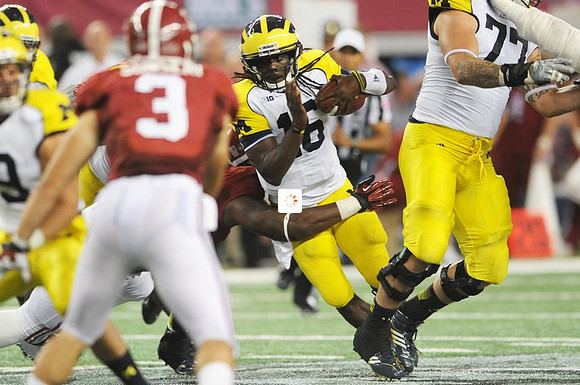 Denard Robinson (16) and Taylor Lewan (77)