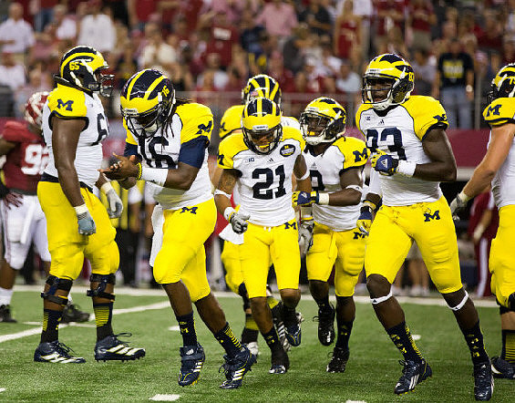 Patrick Omameh (65), Denard Robinson (16), Roy Roundtree (21), Vincent Smith (2), and Stephen Hopkins (33)