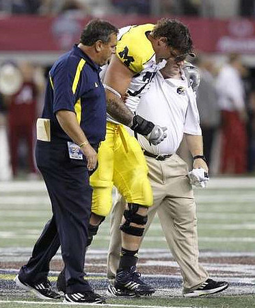 Brady Hoke and Taylor Lewan (77)