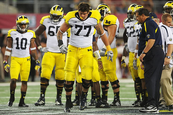 Jeremy Gallon (10), Patrick Omameh (65), Taylor Lewan (77), Elliott Mealer (57), Ricky Barnum (52), and Brady Hoke