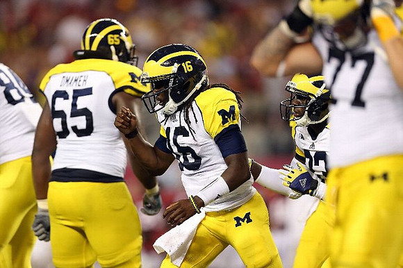 Brandon Moore (89), Patrick Omameh (65), Denard Robinson (16), Stephen Hopkins (33), and Taylor Lewan (77)