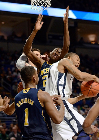 Glenn Robinson III (1) and Caris LeVert (23)