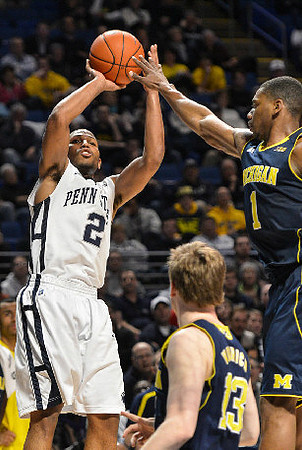 Trey Burke (3) and Nik Stauskas (11)