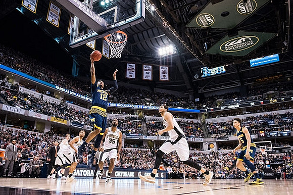 Muhammad-Ali Abdur-Rahkman (12) and D.J. Wilson (5)
