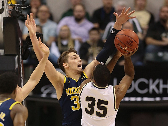 Derrick Walton Jr. (10) and Mark Donnal (34)