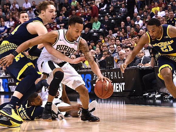 Duncan Robinson (22), Mark Donnal (34), and Zak Irvin (21)