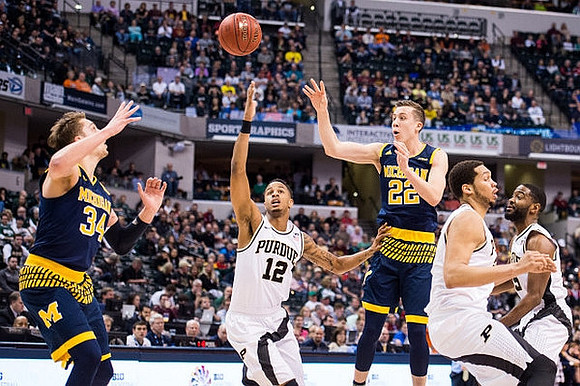 Mark Donnal (34) and Duncan Robinson (22)