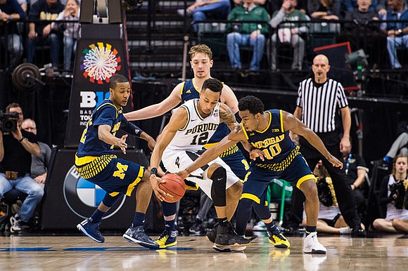 Muhammad-Ali Abdur-Rahkman (12), Mark Donnal (34), and Derrick Walton Jr. (10)