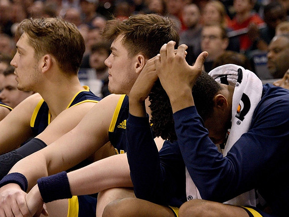Mark Donnal (34), Ricky Doyle (32), and Derrick Walton Jr. (10)